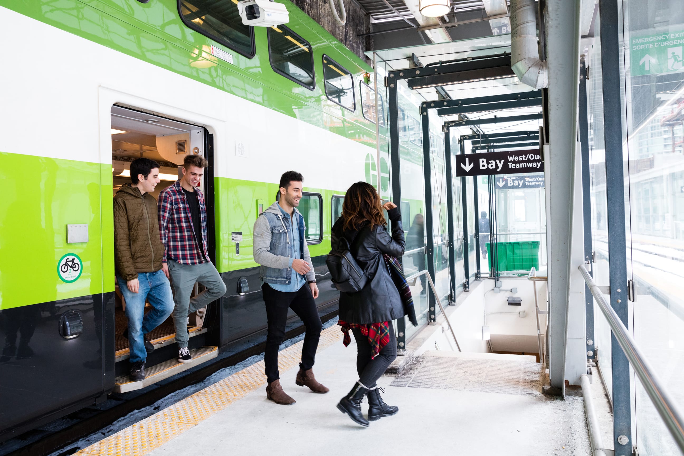 Friends getting off a GO Train.