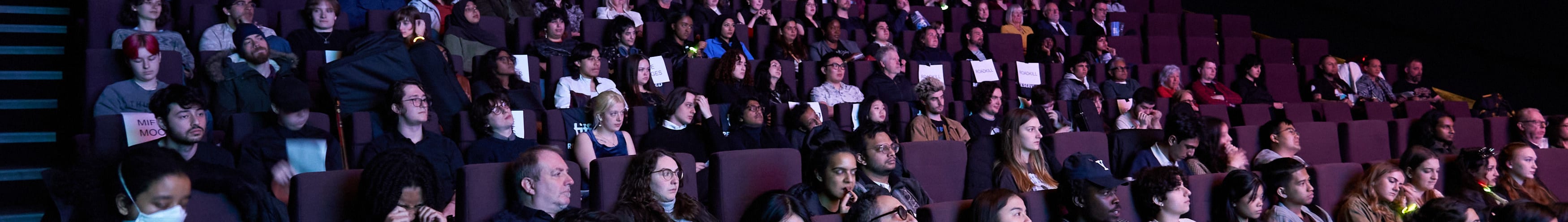 People watching a movie in the theatre