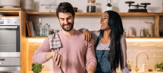 Cooking a meal is a fun and inexpensive Valentine’s Day date activity.