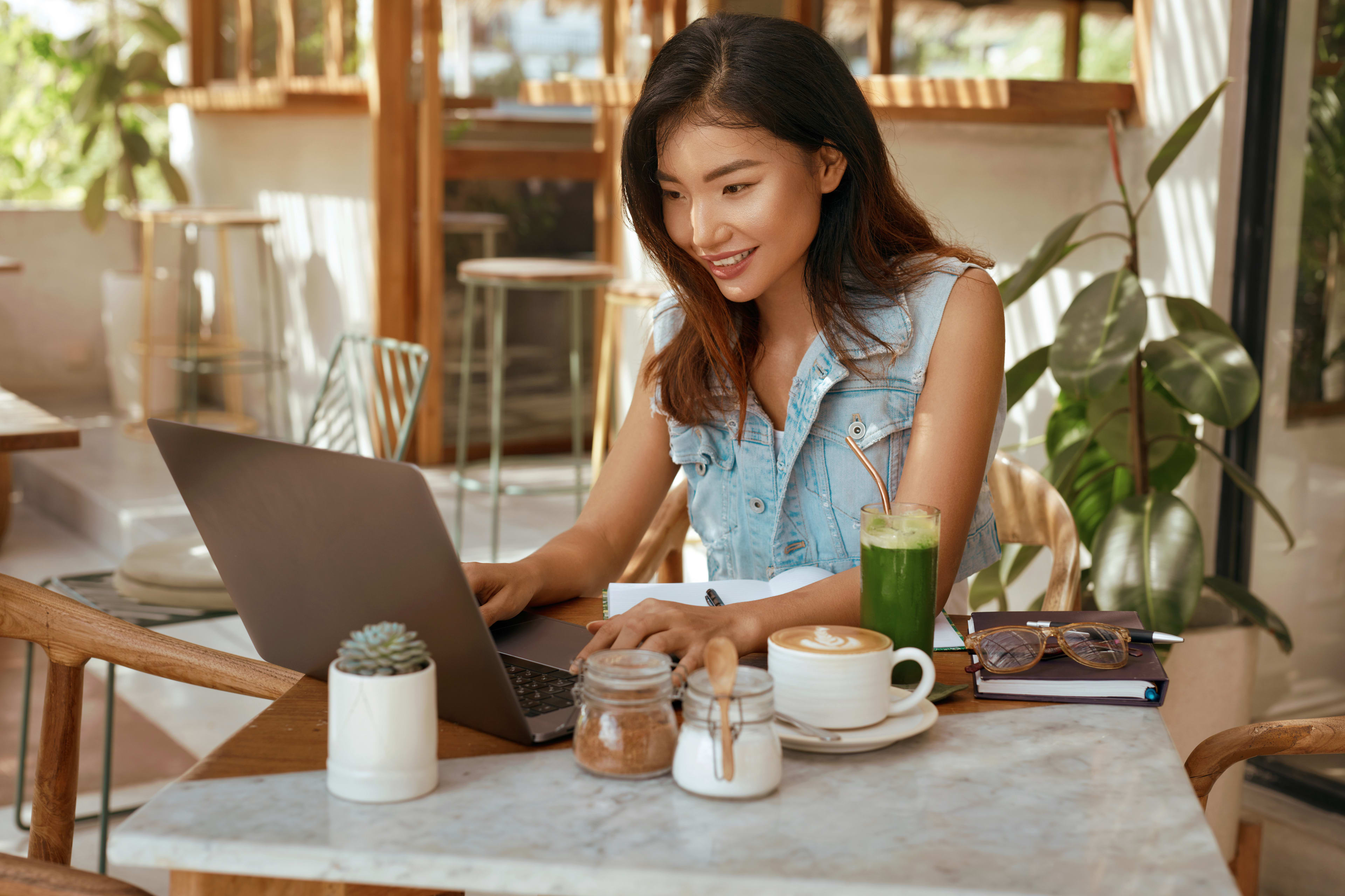 Woman sitting at desk working on laptop