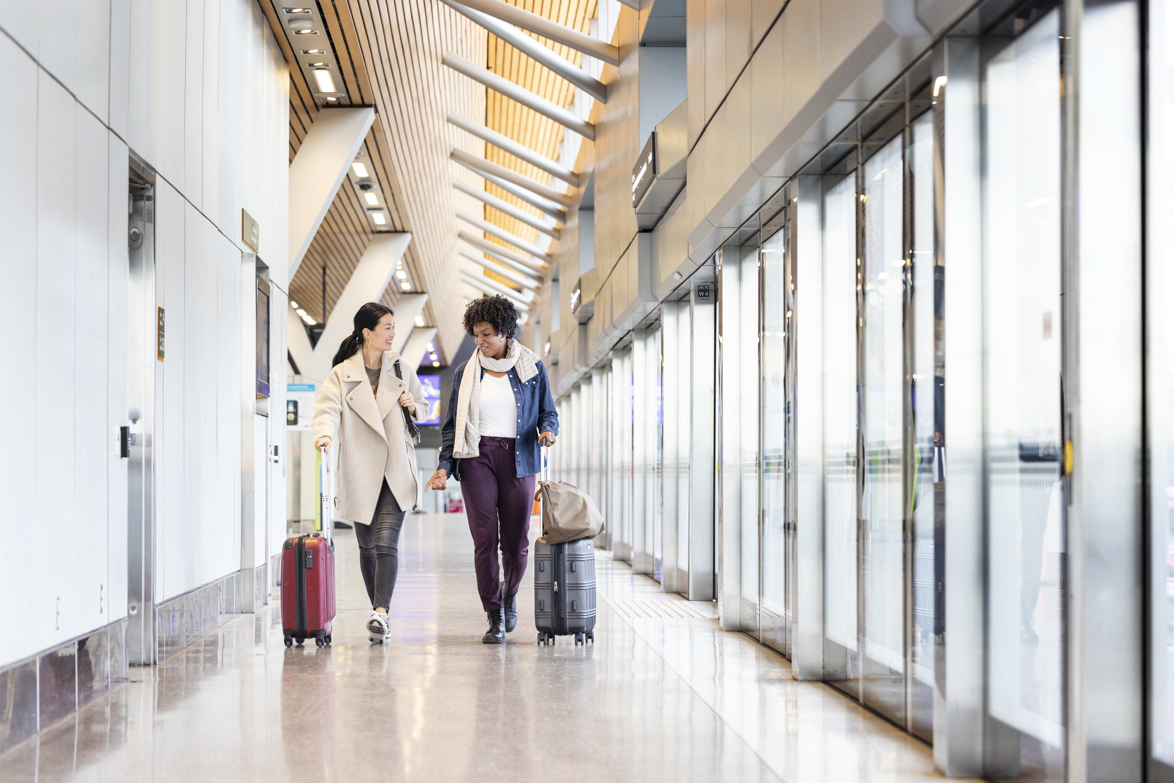 Two females walking down platform at UP Pearson Station