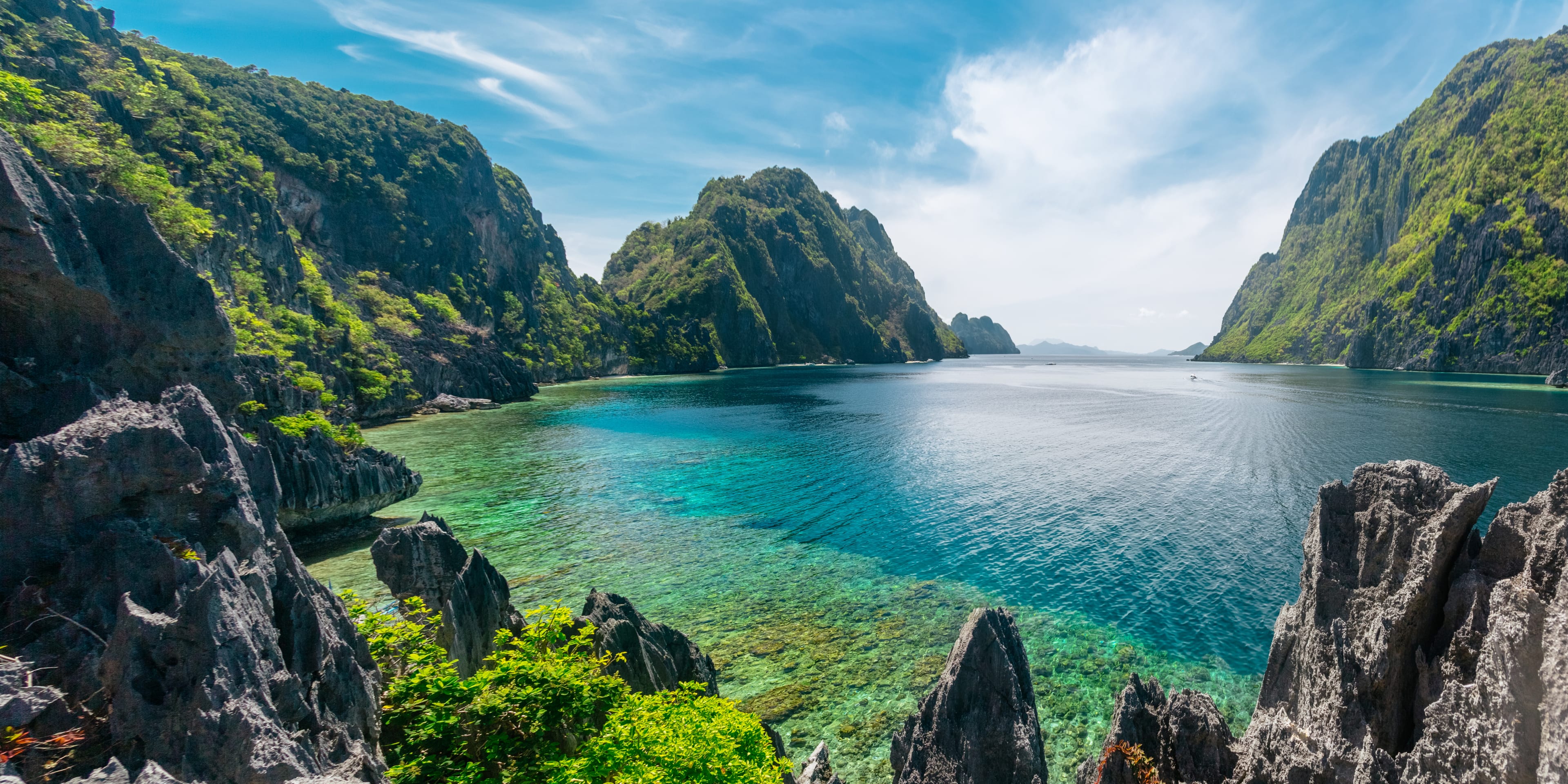 Big Lagoon, a cove with blue water surrounded by green mountains in El Nido, Philipines