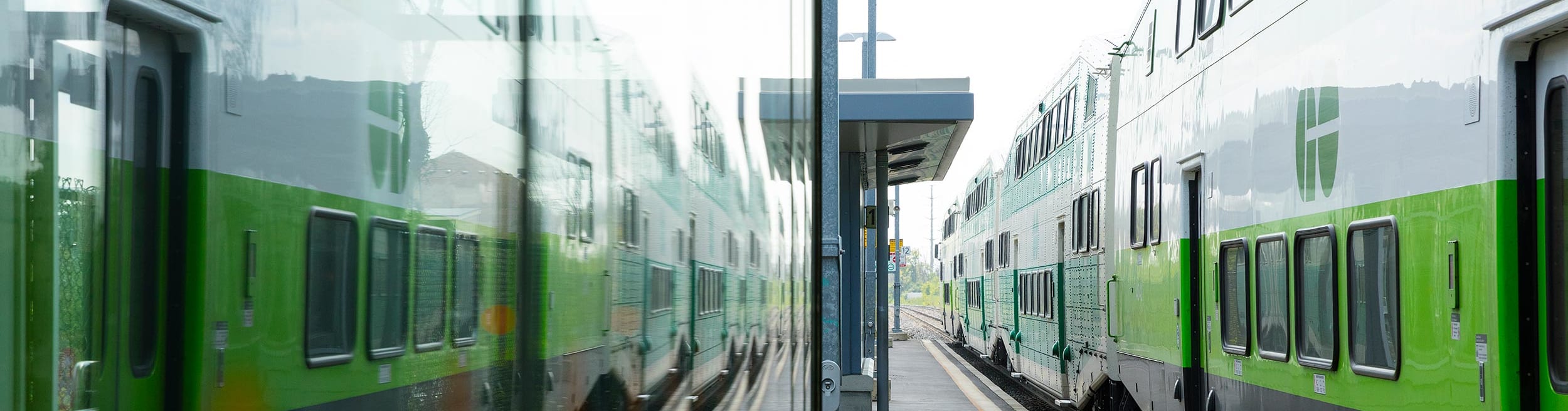 GO Train stopped stopped on an empty platform waiting for passengers