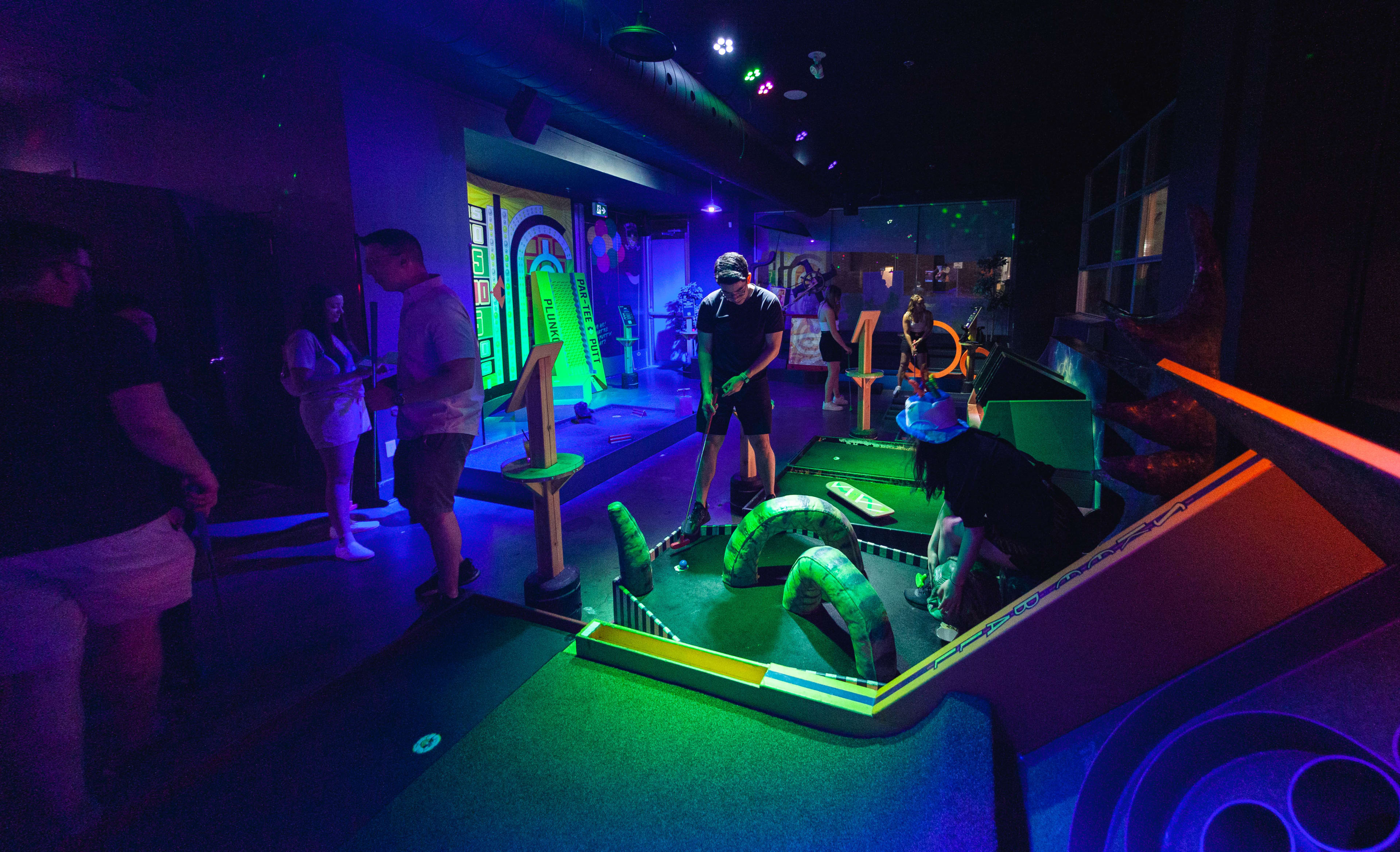 People playing miniature golf at Par-Tee Putt in downtown Toronto