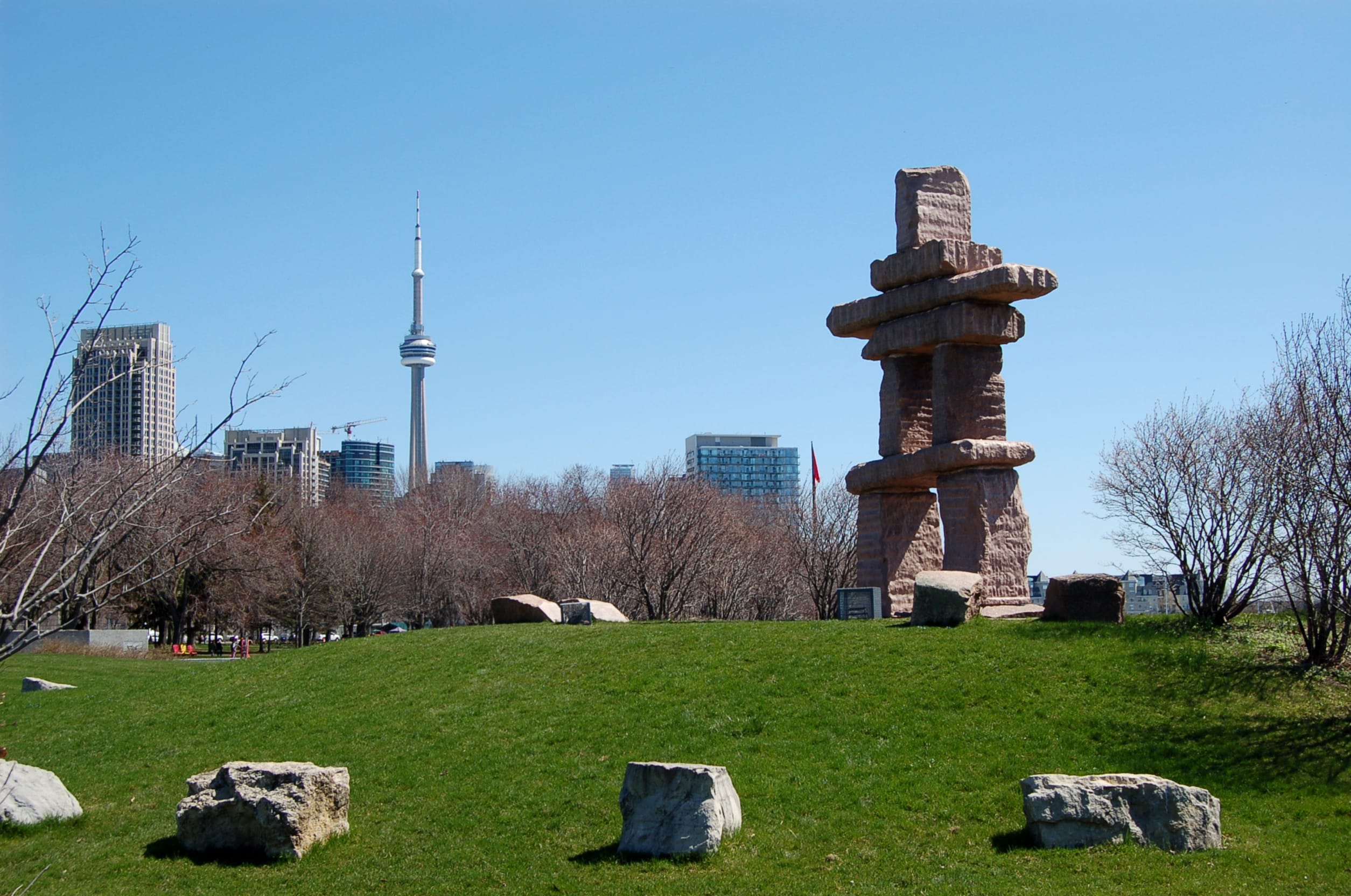 Insukshuk Park in Toronto with CN Tower in the background on a sunny autumn day.